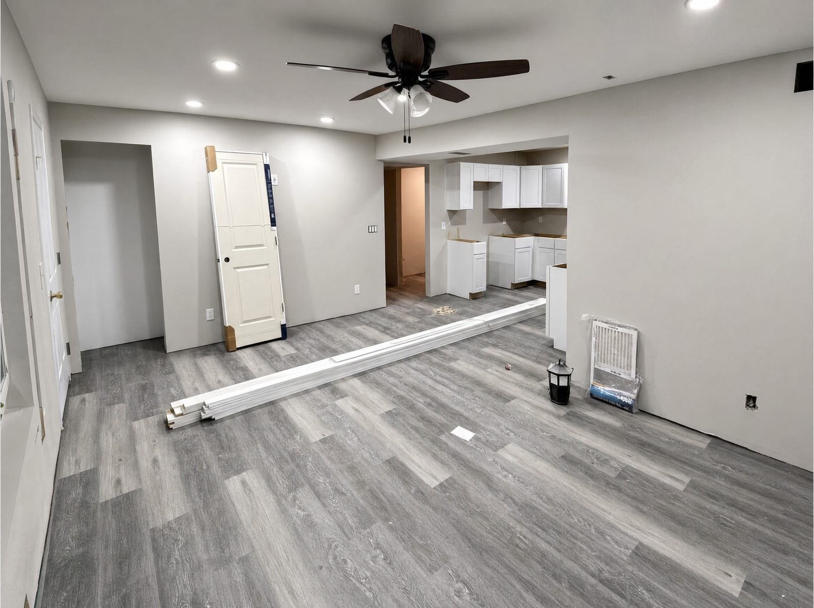 Finished basement living space in Cedar Rapids with new drywall, paint and luxury vinyl plank flooring