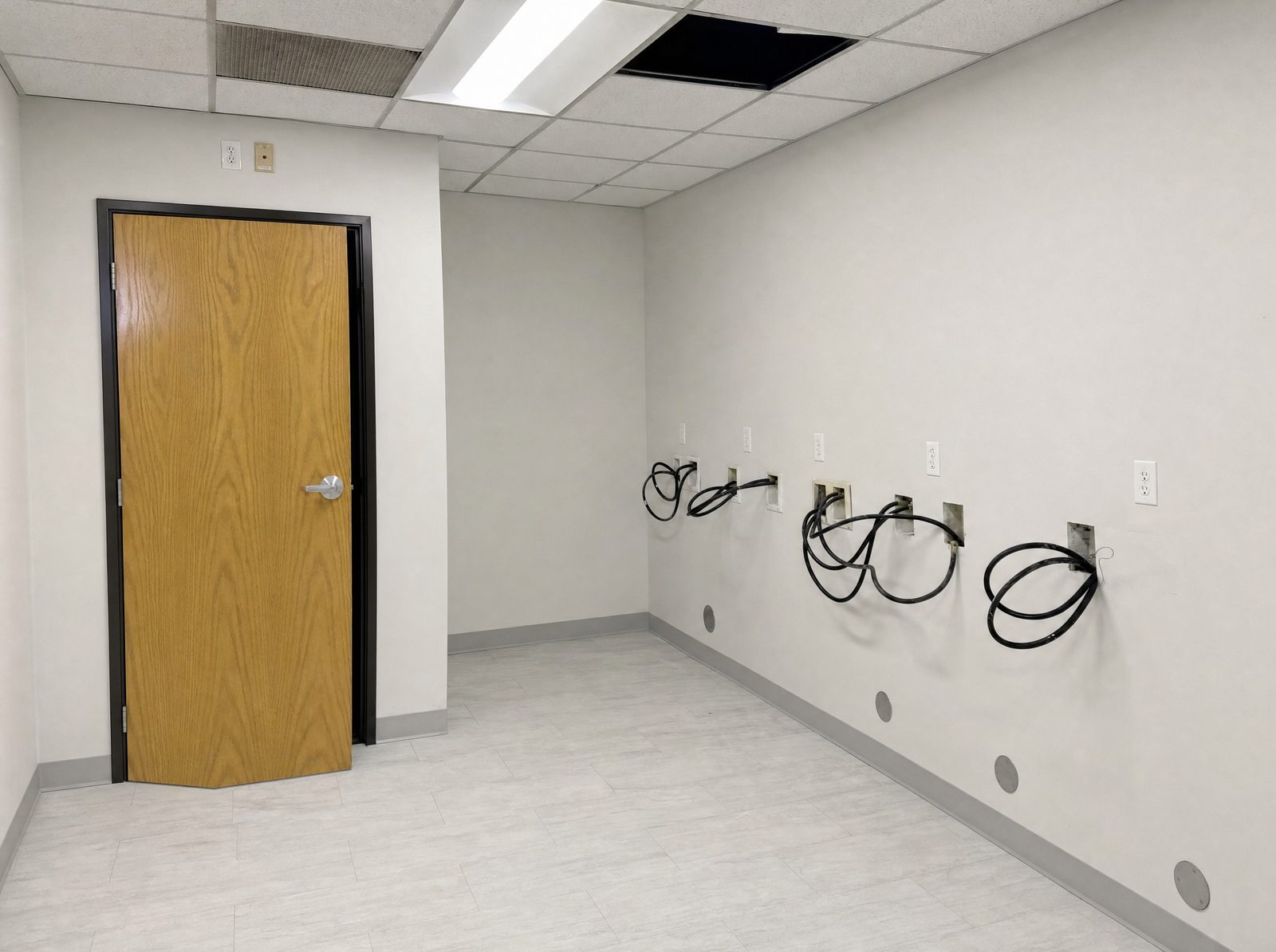 Office after fire damage repair: new drywall, ceiling and flooring